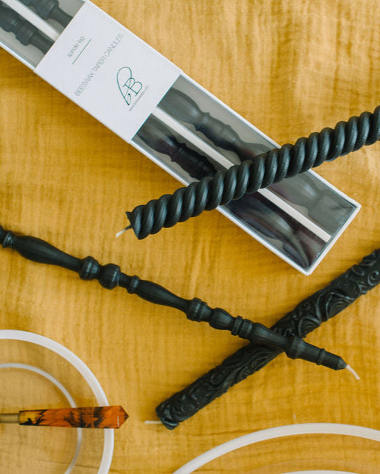 Charcoal black beeswax taper candles in Spindle, Helix and Flora patterns. Exclusively designed by borrowed BLU